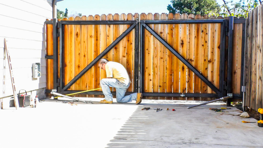 Worker installing Gate